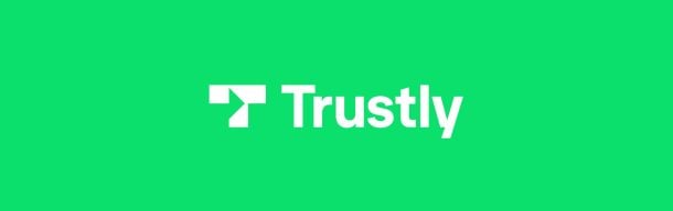 Trustly-kasinot toimivat suoraviivaisesti. Kuvassa Trustlyn valkoinen logo neonvihreällä taustalla.